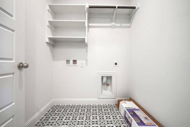 laundry area featuring baseboards, laundry area, hookup for an electric dryer, tile patterned floors, and hookup for a washing machine