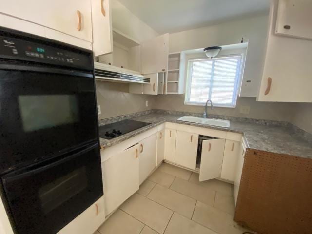 4219 Parkwood Dr, San Antonio, TX 78218 - kitchen with black appliances, white cabinets, a sink, and light tile patterned flooring
