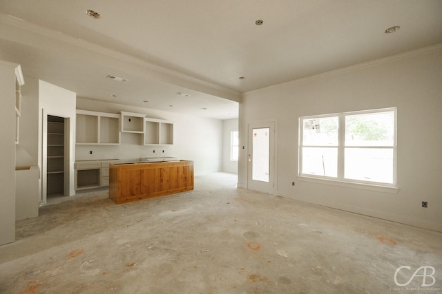 1206 Lytle Acres Dr, Abilene, TX 79602 - kitchen featuring a kitchen island, crown molding, unfinished concrete floors, and open floor plan