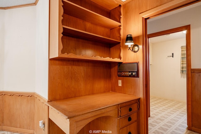 interior space featuring tile patterned floors and wainscoting