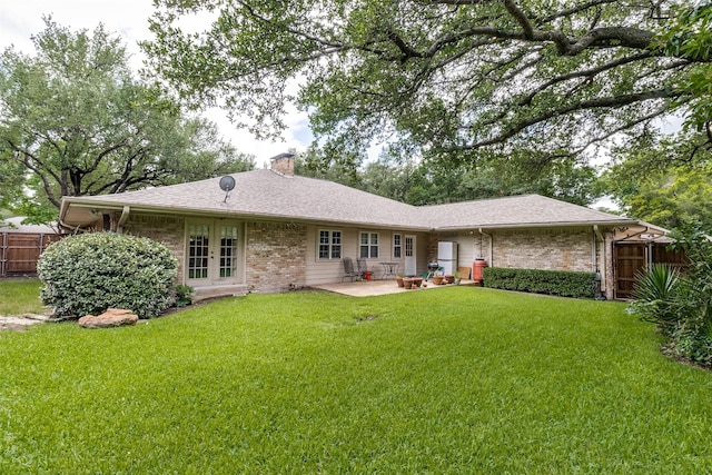 7261 Ashington Dr, Dallas, TX 75225 - rear view of property with french doors, brick siding, a chimney, a patio area, and roof with shingles