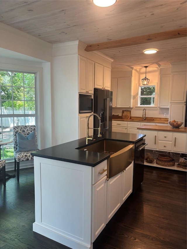 4661 Mockingbird Ln, Highland Park, TX 75209 - kitchen featuring high end black refrigerator, wood ceiling, a sink, white cabinetry, and dark countertops