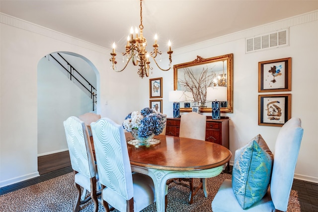 4661 Mockingbird Ln, Highland Park, TX 75209 - dining room with a chandelier, arched walkways, baseboards, and ornamental molding