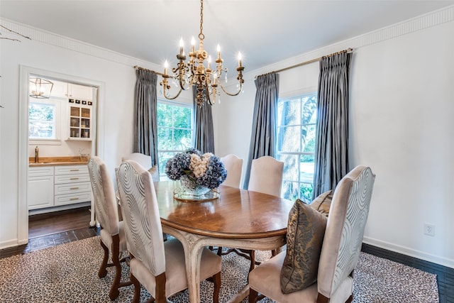 4661 Mockingbird Ln, Highland Park, TX 75209 - dining room featuring a chandelier, dark wood finished floors, ornamental molding, and baseboards