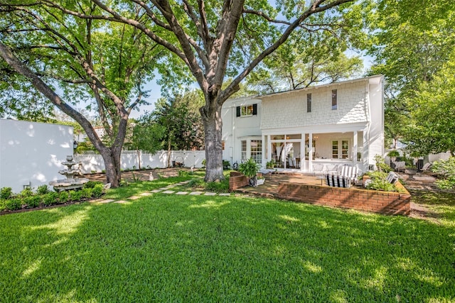 4661 Mockingbird Ln, Highland Park, TX 75209 - rear view of house with a patio area and french doors