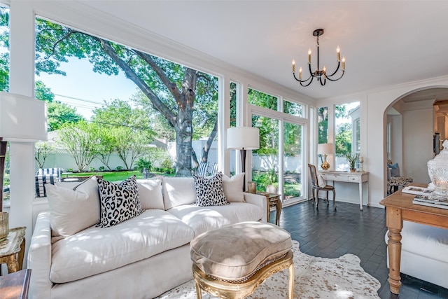 4661 Mockingbird Ln, Highland Park, TX 75209 - sunroom / solarium featuring arched walkways and a chandelier