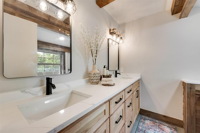 full bathroom with double vanity and a sink