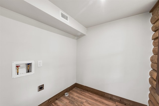clothes washing area with visible vents, baseboards, washer hookup, laundry area, and hookup for an electric dryer