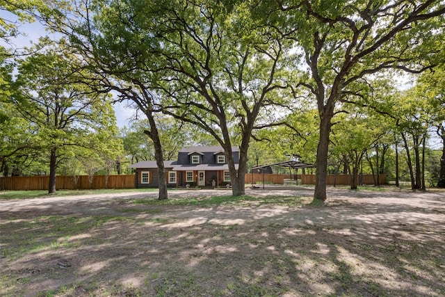 view of front of house featuring fence