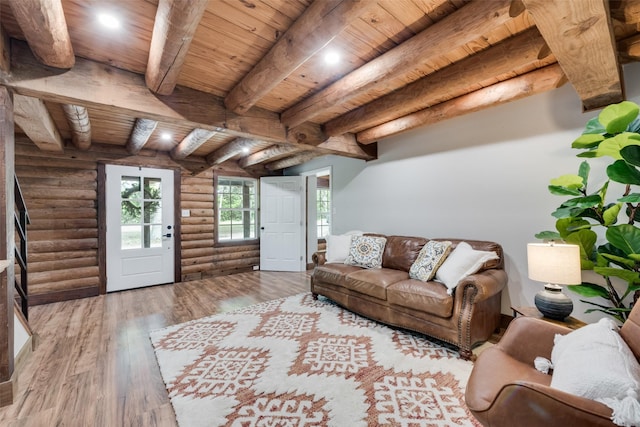 living area with beamed ceiling, recessed lighting, wooden ceiling, wood finished floors, and log walls
