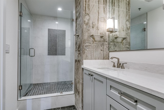4611 Travis St Unit 1408B, Dallas, TX 75205 - bathroom with vanity, a shower stall, and recessed lighting