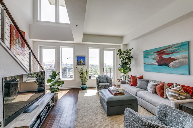 4611 Travis St Unit 1408B, Dallas, TX 75205 - living area featuring hardwood / wood-style flooring and stairway