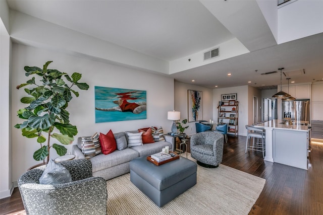 4611 Travis St Unit 1408B, Dallas, TX 75205 - living area featuring dark wood finished floors, recessed lighting, and baseboards