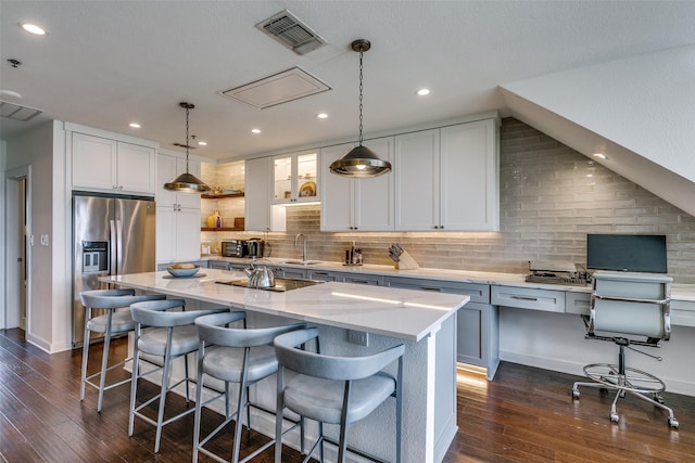 4611 Travis St Unit 1408B, Dallas, TX 75205 - kitchen with stainless steel fridge, a sink, dark wood-style floors, decorative backsplash, and recessed lighting