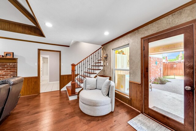 1409 Thames Dr, Plano, TX 75075 - interior space featuring a wainscoted wall, stairs, hardwood / wood-style floors, wooden walls, and ornamental molding