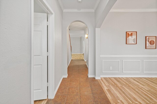 1153 King George Ln, Savannah, TX 76227 - hall with arched walkways, ornamental molding, tile patterned floors, and baseboards
