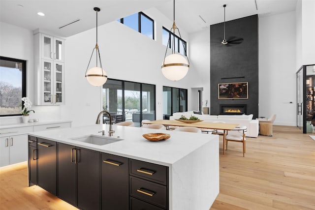 1284 Sunshine Ln, Southlake, TX 76092 - kitchen with a sink, open floor plan, a large fireplace, and a high ceiling