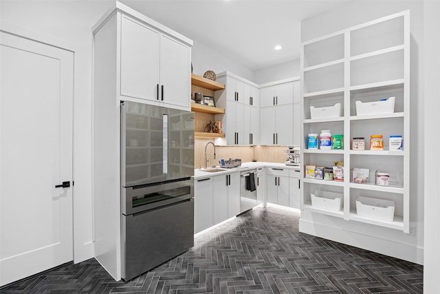 1284 Sunshine Ln, Southlake, TX 76092 - kitchen featuring light countertops, white cabinetry, open shelves, stainless steel appliances, and a sink