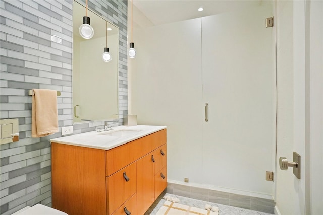 bathroom featuring tile patterned floors, vanity, and baseboards