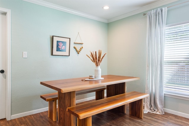 dining space with wood finished floors, baseboards, and a healthy amount of sunlight