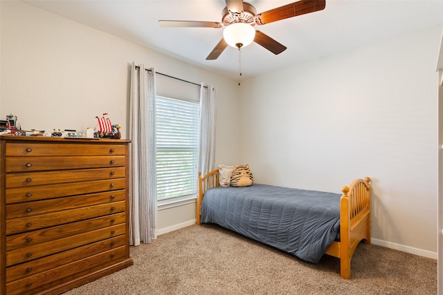 bedroom featuring carpet floors, baseboards, and ceiling fan