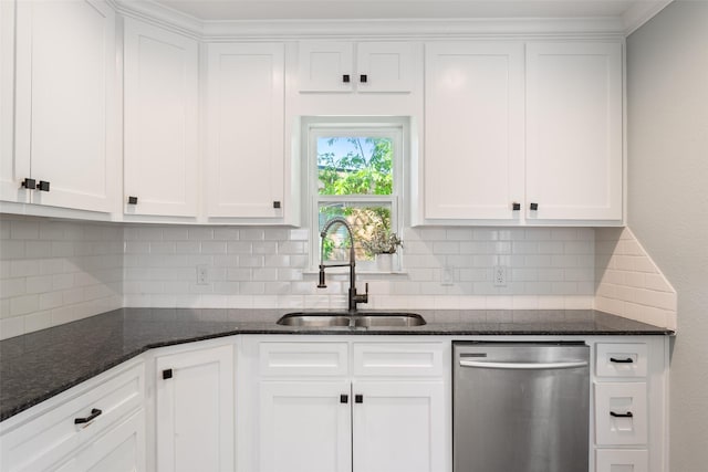 kitchen with decorative backsplash, stainless steel dishwasher, a sink, and white cabinets