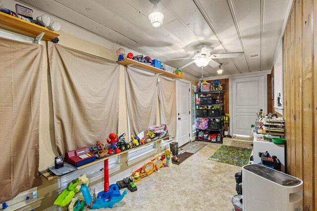 interior space with a ceiling fan