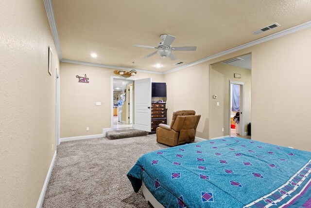 bedroom featuring baseboards, visible vents, carpet, and crown molding