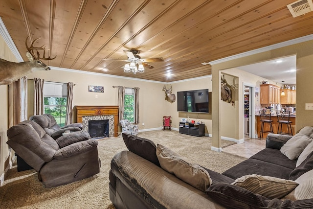 carpeted living area with wood ceiling, visible vents, and ornamental molding