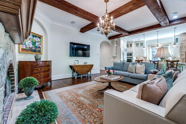 living room with arched walkways, baseboards, dark wood-style floors, beam ceiling, and a notable chandelier