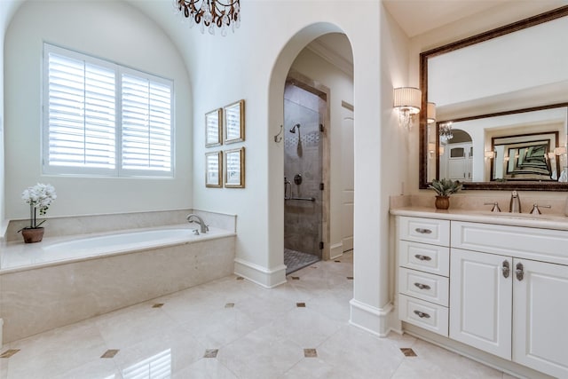 bathroom featuring a bath, tiled shower, vanity, and tile patterned flooring