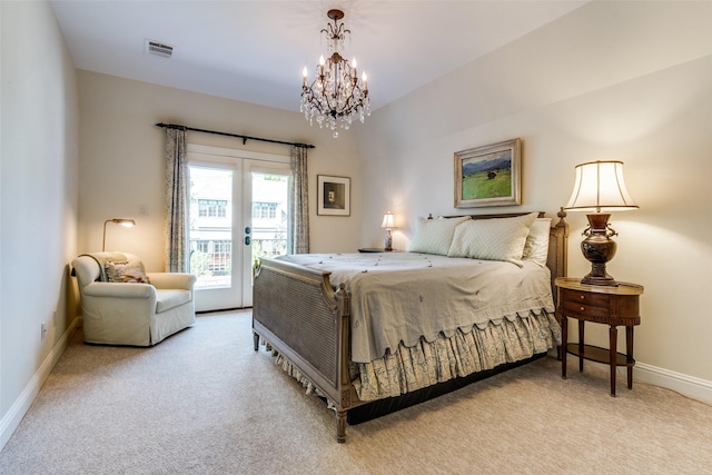 carpeted bedroom with access to outside, visible vents, french doors, baseboards, and a notable chandelier
