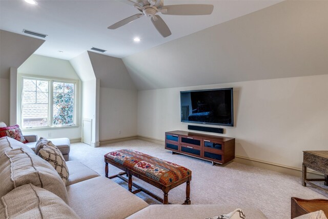 living area with visible vents, baseboards, carpet flooring, and lofted ceiling