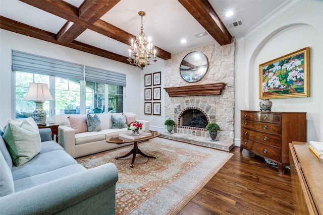 living room featuring an inviting chandelier, a fireplace, visible vents, beamed ceiling, and dark wood finished floors