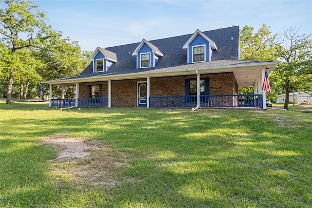 260 Winding Way, Fairfield, TX 75840 - farmhouse-style home featuring brick siding, a front yard, covered porch, and a shingled roof