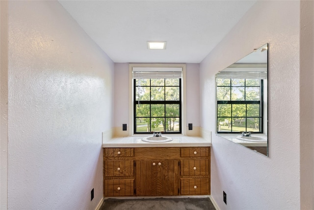 260 Winding Way, Fairfield, TX 75840 - bathroom featuring a textured wall, vanity, and baseboards