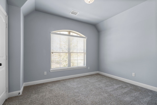 1208 Claire St, Lantana, TX 76226 - empty room with carpet, vaulted ceiling, and baseboards