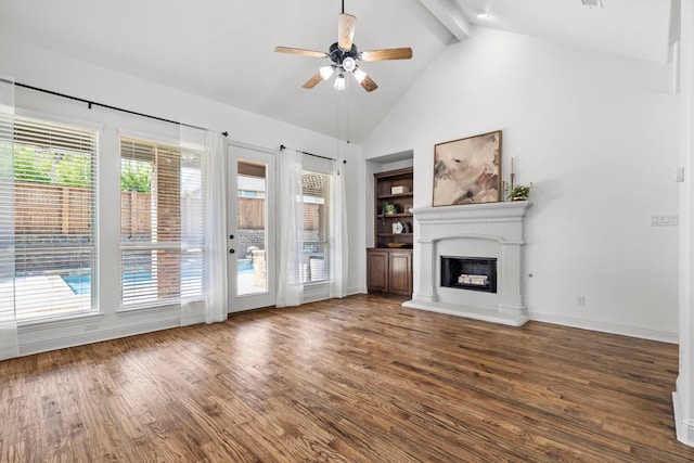 1208 Claire St, Lantana, TX 76226 - unfurnished living room featuring ceiling fan, wood finished floors, a fireplace with raised hearth, beamed ceiling, and high vaulted ceiling