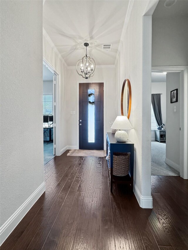 3906 Greenbrier Dr, Melissa, TX 75454 - foyer entrance with baseboards, an inviting chandelier, ornamental molding, visible vents, and hardwood / wood-style floors