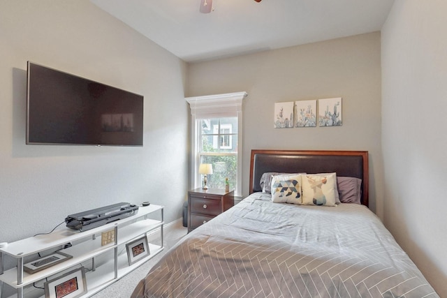 bedroom featuring carpet, baseboards, and ceiling fan