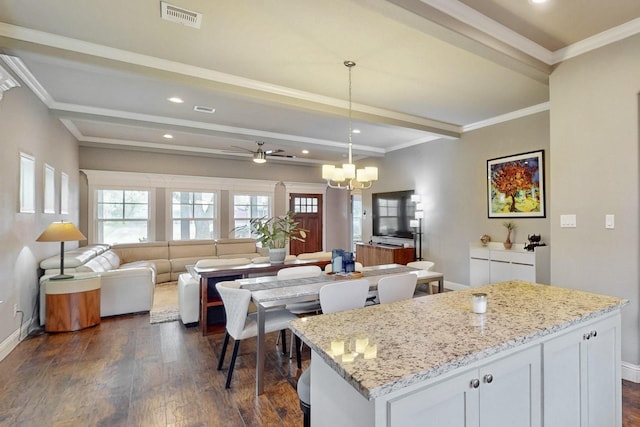 kitchen featuring dark wood-type flooring, baseboards, recessed lighting, pendant lighting, and beam ceiling