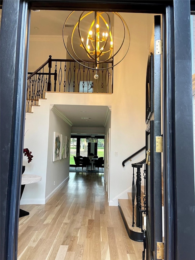 5919 Club Hill Pl, Dallas, TX 75248 - foyer entrance featuring ornamental molding, stairway, a chandelier, wood finished floors, and baseboards