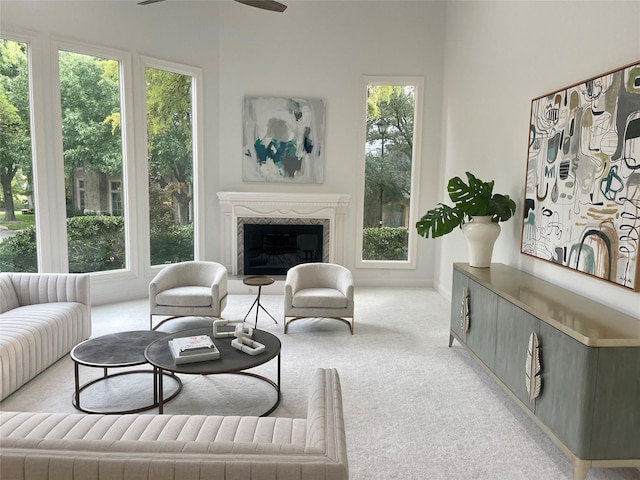 5919 Club Hill Pl, Dallas, TX 75248 - living room featuring a ceiling fan, carpet, a high end fireplace, and a healthy amount of sunlight