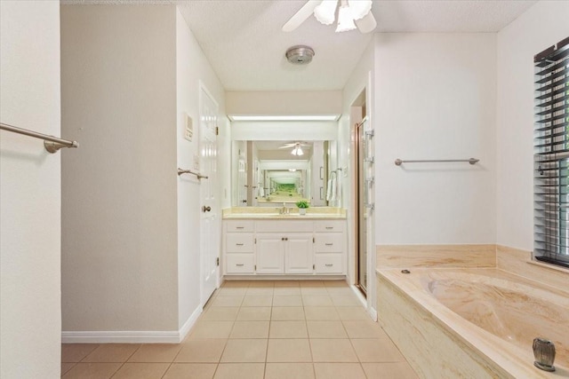 10010 Lost Oak Ridge Dr, Woodway, TX 76712 - full bath featuring a ceiling fan, tile patterned floors, vanity, and a garden tub