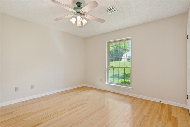 10010 Lost Oak Ridge Dr, Woodway, TX 76712 - empty room featuring light wood-type flooring, ceiling fan, baseboards, and a textured ceiling