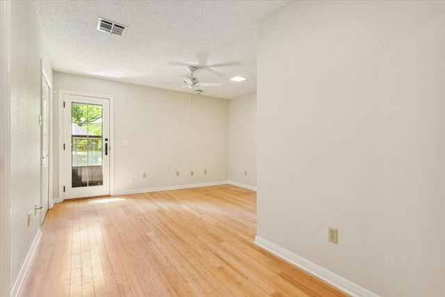 10010 Lost Oak Ridge Dr, Woodway, TX 76712 - unfurnished room with a ceiling fan, light wood-style floors, baseboards, and a textured ceiling