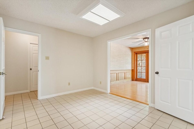10010 Lost Oak Ridge Dr, Woodway, TX 76712 - spare room featuring a textured ceiling and light tile patterned floors