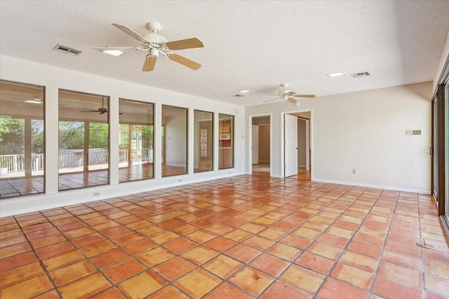 10010 Lost Oak Ridge Dr, Woodway, TX 76712 - spare room with healthy amount of natural light, a textured ceiling, ceiling fan, and light tile patterned floors