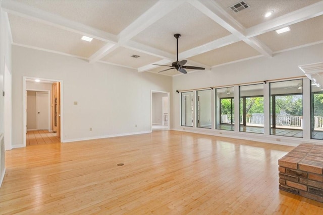 10010 Lost Oak Ridge Dr, Woodway, TX 76712 - unfurnished living room with coffered ceiling, a ceiling fan, baseboards, light wood-type flooring, and beam ceiling