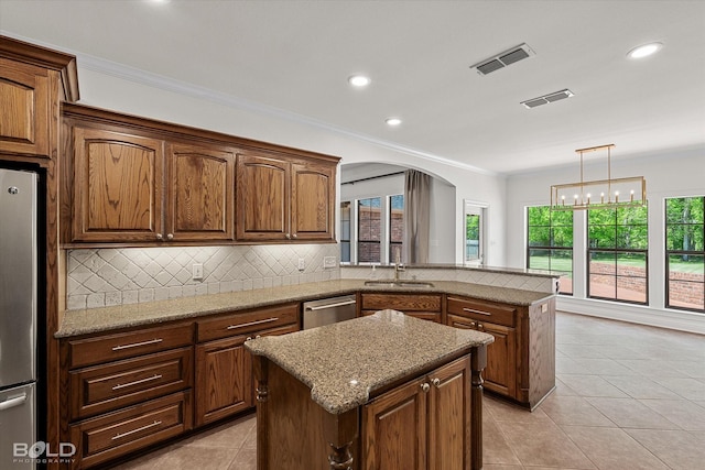 106 Horseguards Ave, Bossier City, LA 71111 - kitchen featuring backsplash, visible vents, a peninsula, stainless steel appliances, and light tile patterned flooring